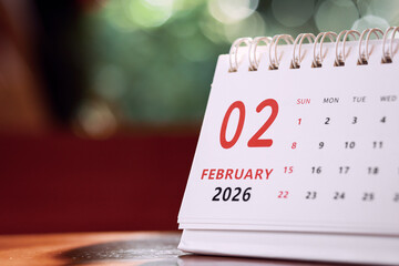 Calendar page of February 2026 on desk, with copy space. monthly planning concept, important schedules, meetings, and appointments.