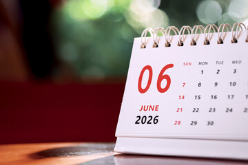 Calendar page of June 2026 on desk, with copy space. monthly planning concept, important schedules, meetings, and appointments.