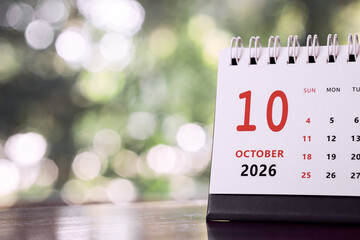 Calendar page of October 2026 on desk, with copy space. monthly planning concept, important schedules, meetings, and appointments.