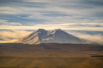 View of Mount Elbrus from the Resort Park in Kislovodsk, Russia. © larisa_stock