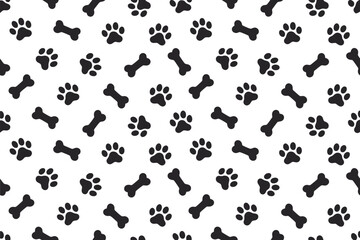 A playful pattern of black paw prints and dog bones on a white background