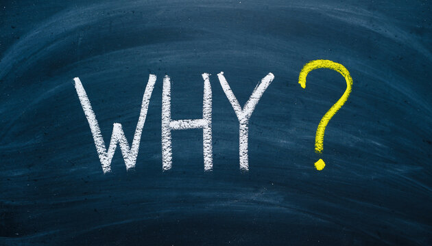 White and yellow why question mark on a dark blue chalkboard background