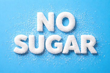 No Sugar Concept Text Made from White Sugar Crystals on Blue Background