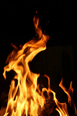 Fototapeta premium fire red flames burning in the cozy home fire place