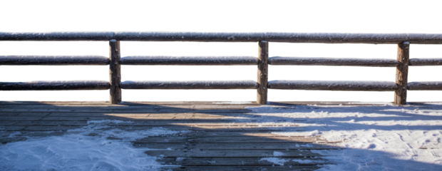 Wooden Fence And Deck Covered With Snow features timber railing and floor planks with white ice surface in winter