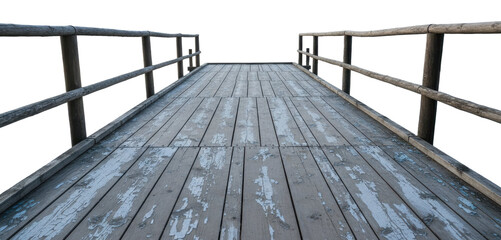 Old Wooden Pier Bridge With Peeling Paint features weathered timber planks and rustic railings leading forward with perspective view
