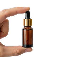 Naklejka premium Hand holding small amber glass bottle with dropper isolated on transparent background