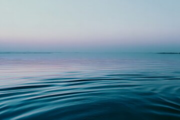 Serene water surface reflecting soft hues at blue hour, creating a tranquil atmosphere with gentle ripples and a peaceful ambiance, ideal for relaxation and meditation