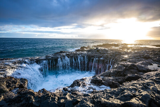 Sunrise Bufadero water blasting into the air on the coast of Gran Canaria in the Canary Islands