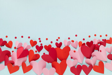 Hearts ornaments on blue blank background. Valentine or Mother Day greeting card festive mockup.