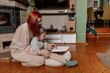 Mother and Toddler Playing Together on the Floor