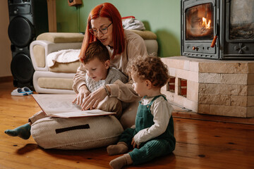 Mother and Son Sharing a Book in a Cozy Living Room