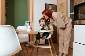 Mother and Toddler Sharing a Tender Moment in the Kitchen