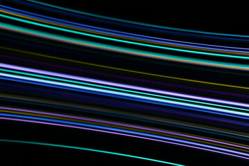 A long exposure photograph. Light painting photography, vibrant fairy lights in parallel lines and streaks against a black background
