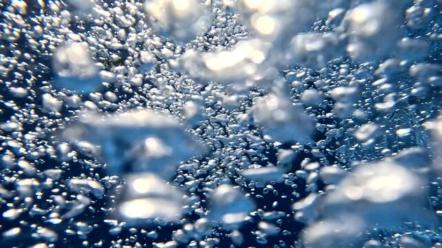 Bubbles rising in underwater scene captured from different angles