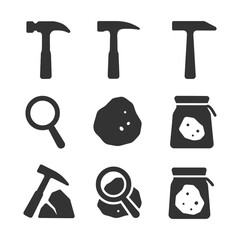 Mining tools and materials icon set featuring hammers, magnifying glass, and rocks.