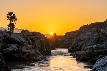 Sunsets over Kunene River scenery between Angola and Namibia, Southern Africa