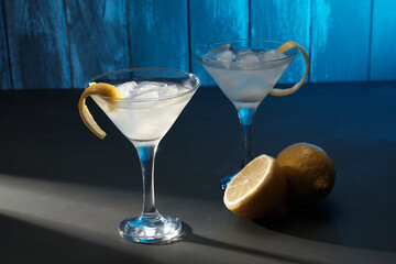 Freshly Made Cocktails With Ice and Lemon on a Dark Surface