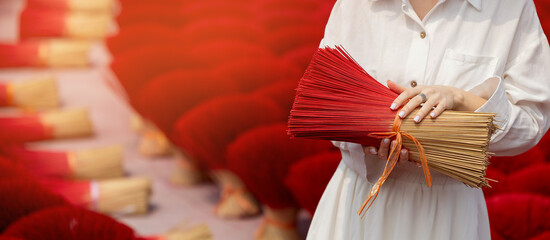 Traditional incense stick production in vietnamese village, woman hold aroma