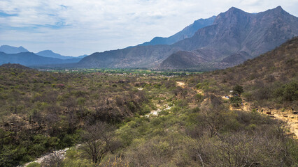 Naklejka premium Mountain landscape of Mayascón rising above rural valleys in Lambayeque, Peru