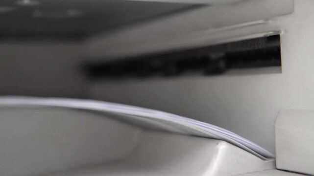 Laser printer printing business document sheets in office
