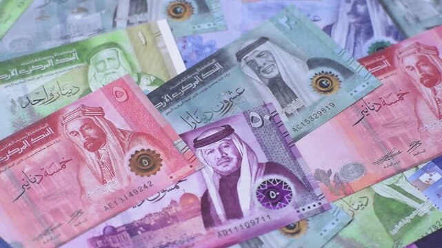 Jordan money, the Jordanian dinar currency, banknotes of various denominations, financial transactions. Jordanian money, the dinar as a financial background for your design
