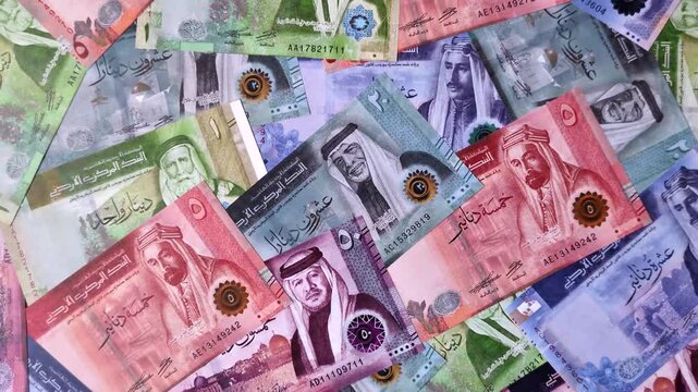 Jordan money, the Jordanian dinar currency, banknotes of various denominations, financial transactions. Jordanian money, the dinar as a financial background for your design