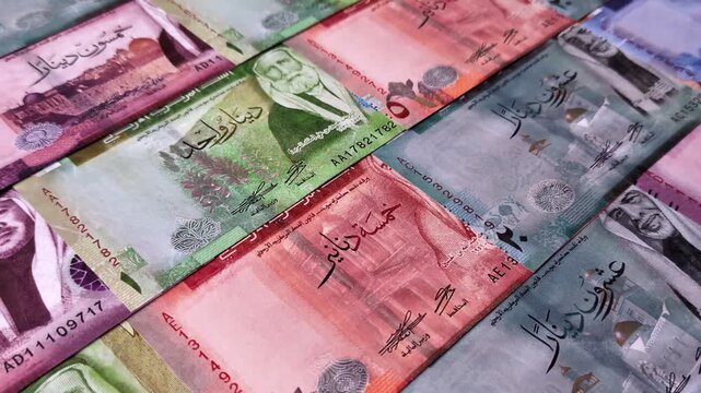 Jordan money, the Jordanian dinar currency, banknotes of various denominations, financial transactions. Jordanian money, the dinar as a financial background for your design