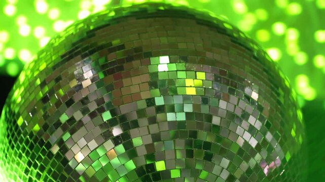Bright glowing disco balls set rotate with rays isolated on black background