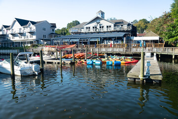 Waterfront marina with kayaks and small boats in everyday coastal town setting Virginia.
