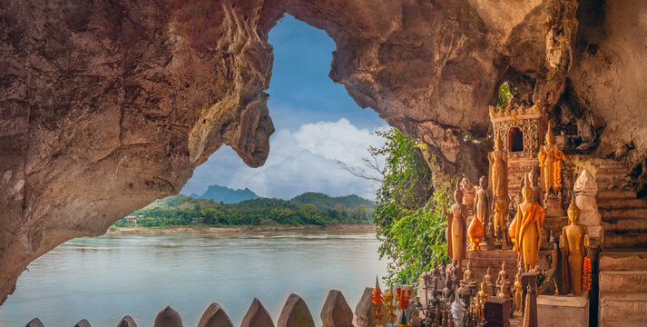 Buddhist shrine in the stunning natural setting of the Tham Tring (lower) cave, Pak Ou Caves, confluence of the Ou and Mekong rivers, Luang Prabang, Laos