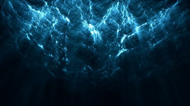View of the ocean waves from under the water. Seamlessly looped video. Bottom-up view. Dramatic blue lighting.