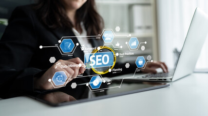 A businesswoman engages with advanced SEO tools and metrics on her laptop, showcasing modern digital marketing strategies in a contemporary office space. Tessel