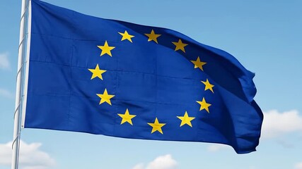 The iconic European Union flag proudly waves in a gentle breeze against a clear blue sky symbolizing unity peace and cooperation across the continent representing the collective identity and shared v.