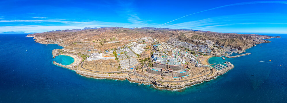  Aerial of People Relaxing at Luxury Cliffside Resorts Overlooking Puerto Rico Marina and the Atlantic Coastline, Gran Canaria, Spain