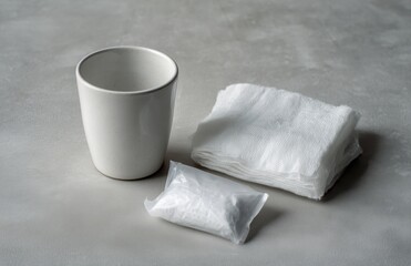 Fototapeta premium Dental Aftercare Kit With Rinsing Cup and Sterile Gauze Pads