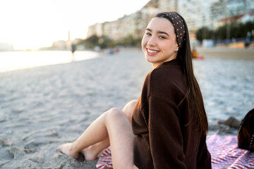 Young woman enjoying leisure time on winter beach