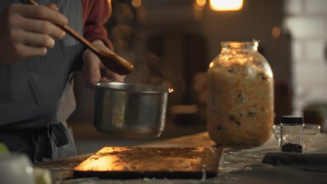 A craftsman prepares a natural marinade for fermenting cabbage, showcasing traditional preserving techniques to create sour sauerkraut, highlighting mindful cooking with fresh produce