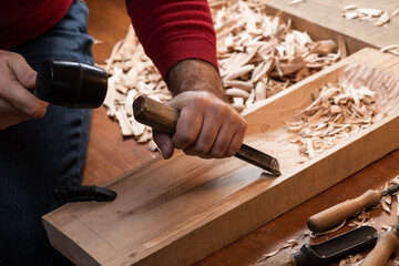 The master hollows out a cavity in the blank for the tagelharpa