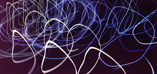 Linear composition. Аbstract long-exposure photograph depicting colorful neon light trails against a dark background.