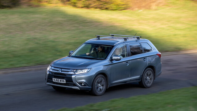 Milton Keynes,Bucks,UK - Dec 15th 2025:  2016 Mitsubishi Outlander SUV car driving on a British road