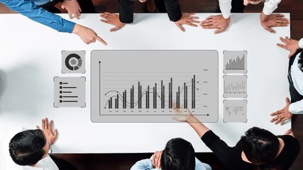 A business team collaborates in a conference room, analyzing data through charts and graphs on a table to enhance decision-making and strategic planning. Raster - Powered by Adobe