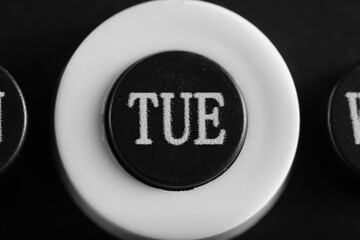 Abbreviated designation day week on calendar in close up, Tuesday.