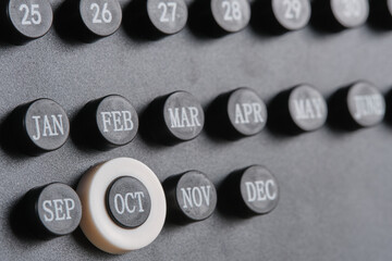 Stylish black calendar with dates and month marked October.