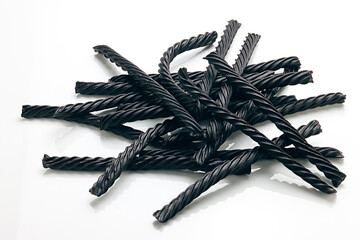 Black Licorice , individual close-up and piles on white background