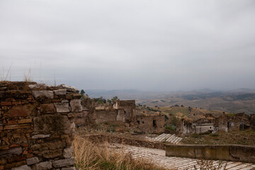 Craco is a famous "Ghost town" in Basilicata, Italy. Residents abandoned it after several earthquakes caused landslides, making the houses on the slopes slide and collapse.