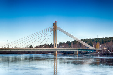 The famous Lumberjack's Candle Bridge over Kemijoki river in Rovaniemi, Finland. HDR.