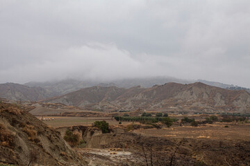 Calanchi are unique 'badlands' in Basilicata, Italy, formed by white clay erosion in the area surrounding the ghost town, Craco.