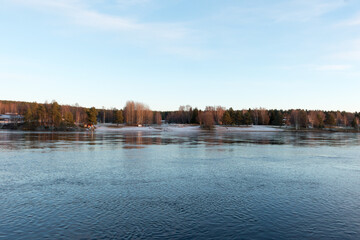 Bank of Kemijoki River in the city of Rovaniemi. Lapland, Finland.