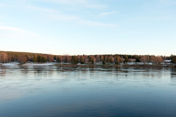 Bank of Kemijoki River in the city of Rovaniemi. Lapland, Finland. 